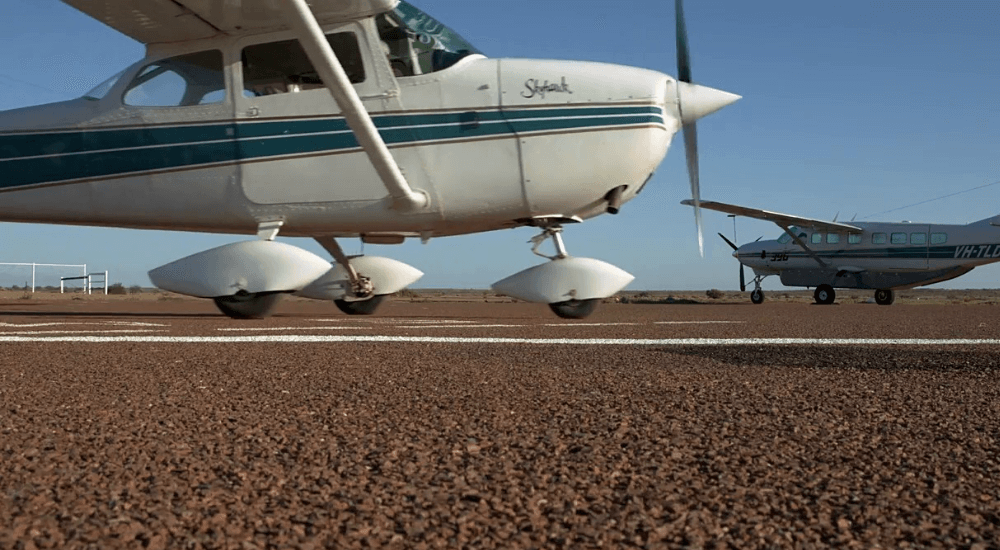 Single engine aircraft on the runway at William Creek, SA
